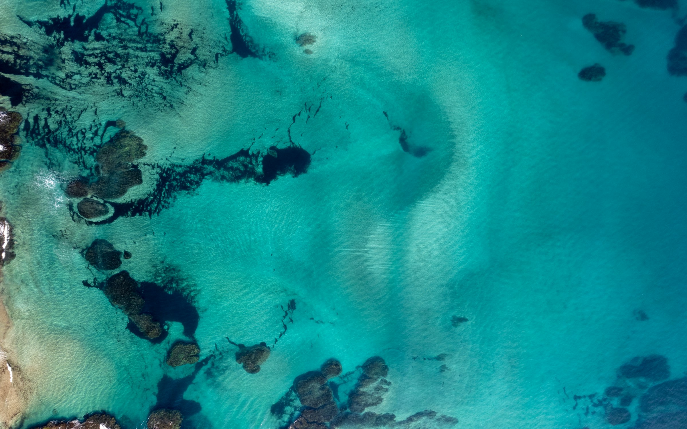 Turquoise reef and sea seen from above